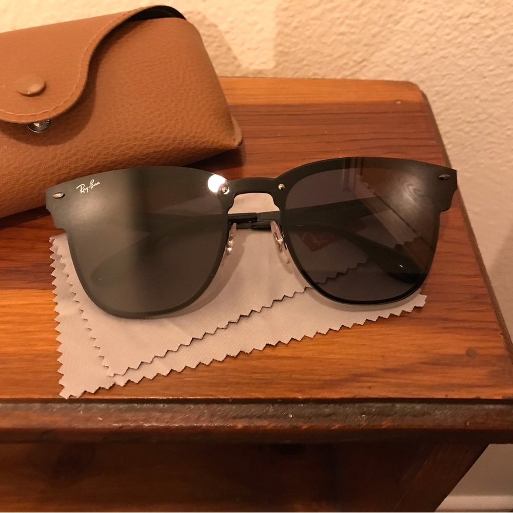Ray Ban sunglasses. Never worn, they were a gift from an ex…